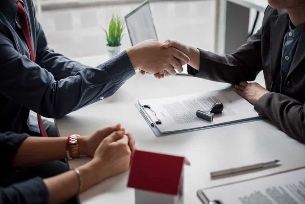 Businessman shaking hands in the office, Signing of the real estate sale agreement between buyer