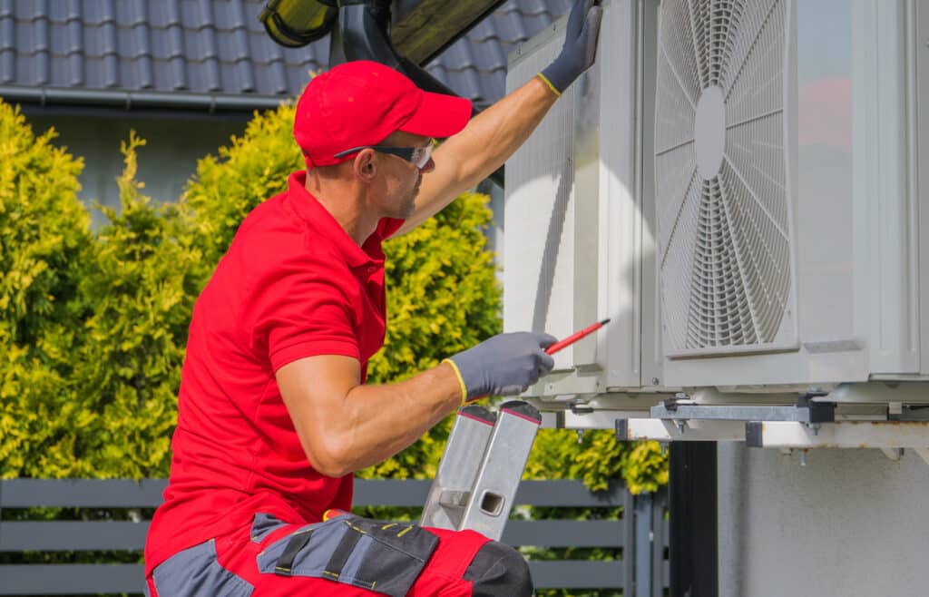 Residential Air Conditioning Maintenance Technician at Work